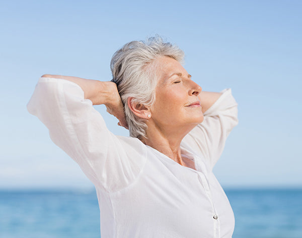 Senior woman relaxing on the beach