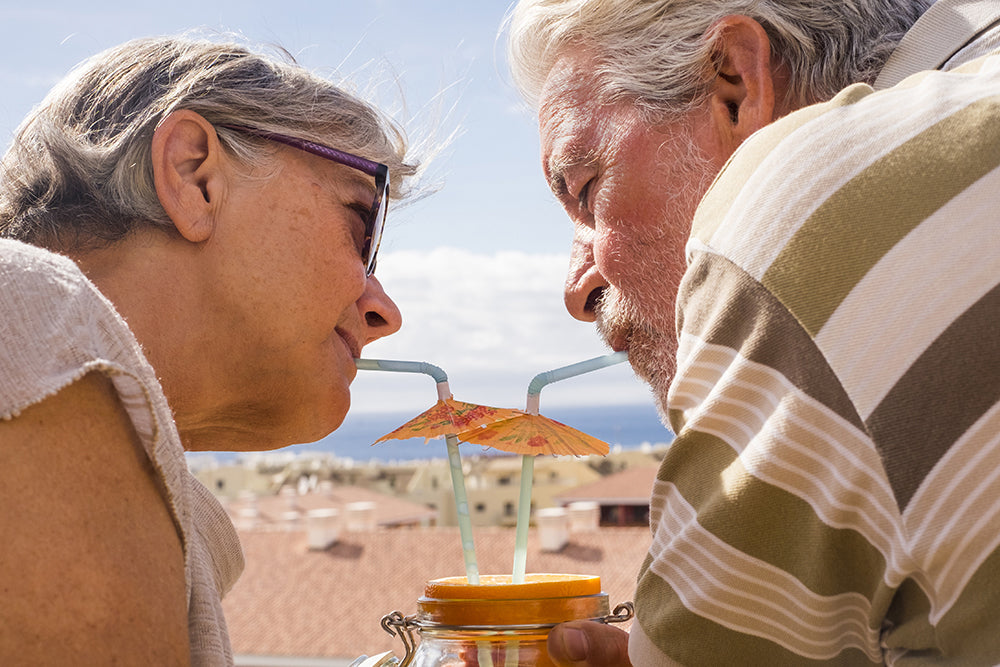 Old woman and man with a cocktail