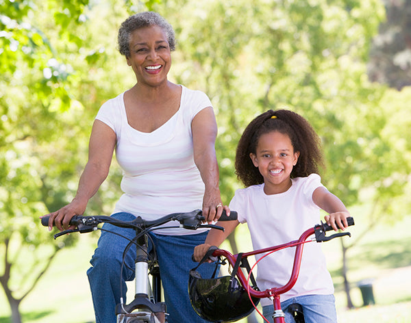 Grandmother and granddaughter on bikes